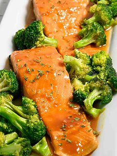 Maple Mustard Salmon on a plate with broccoli.