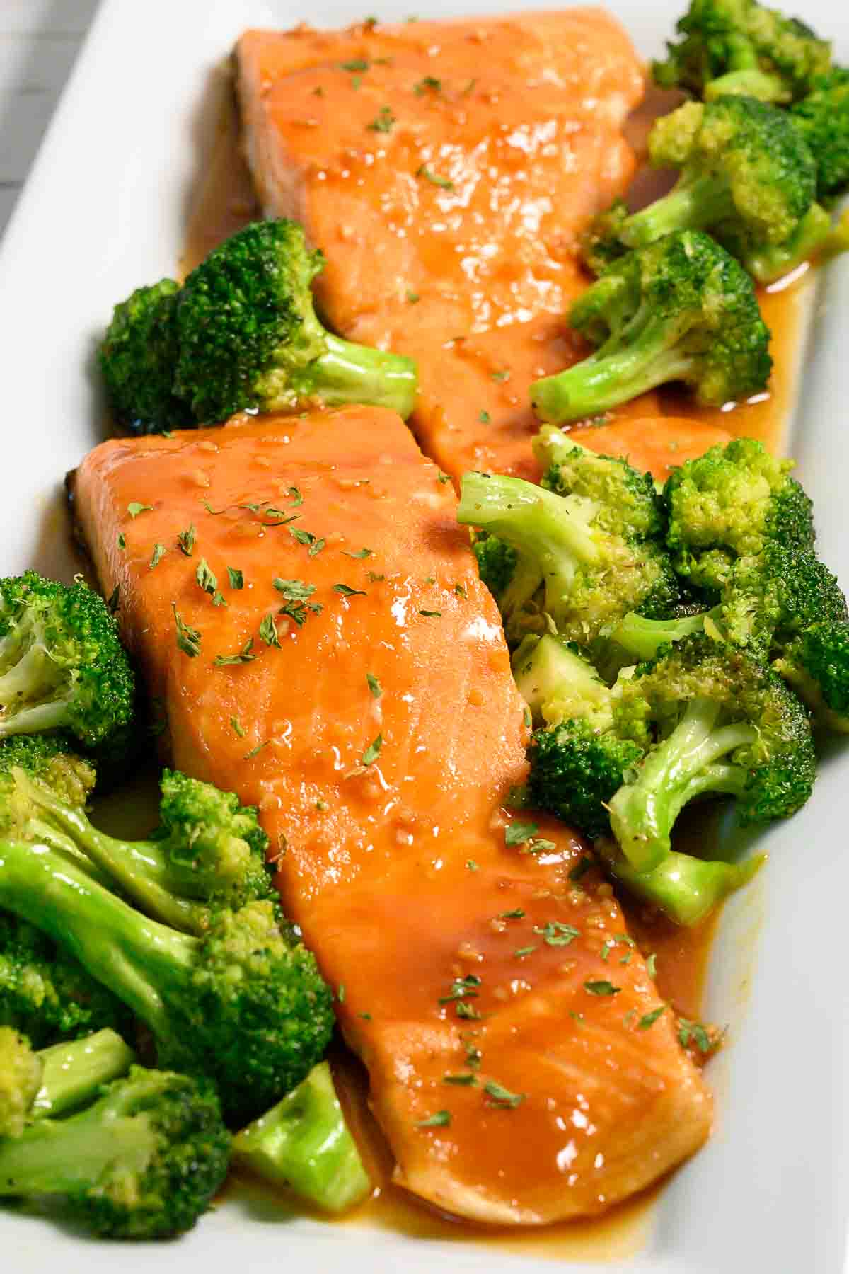 Maple Mustard Salmon on a plate with broccoli.