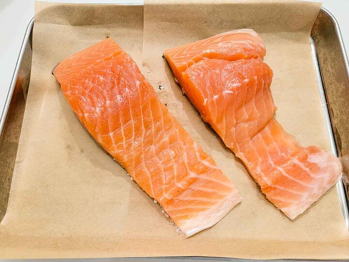 salmon filets on a baking sheet.